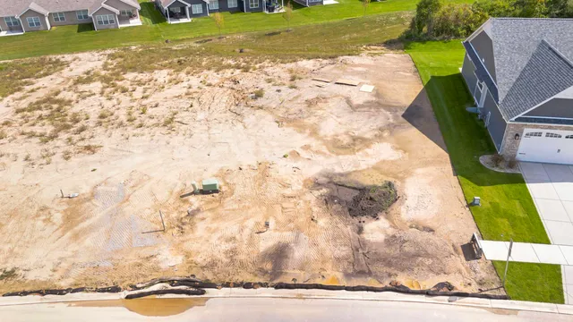 a aerial view of a house with yard