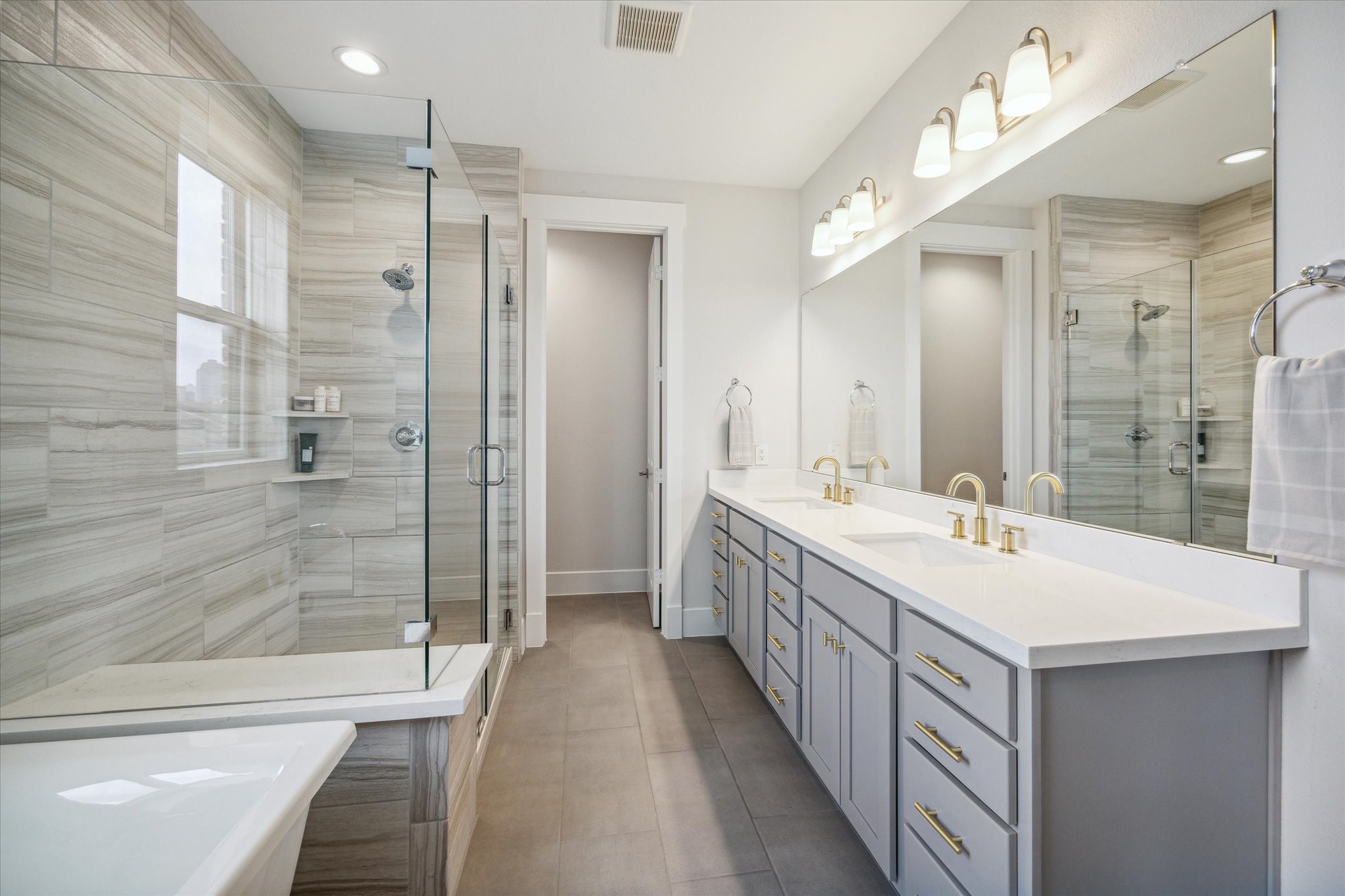 2803 Hicks Street Houston, TX 77007 - Photo 13 of 16 a bathroom with a double vanity sink mirror double and shower
