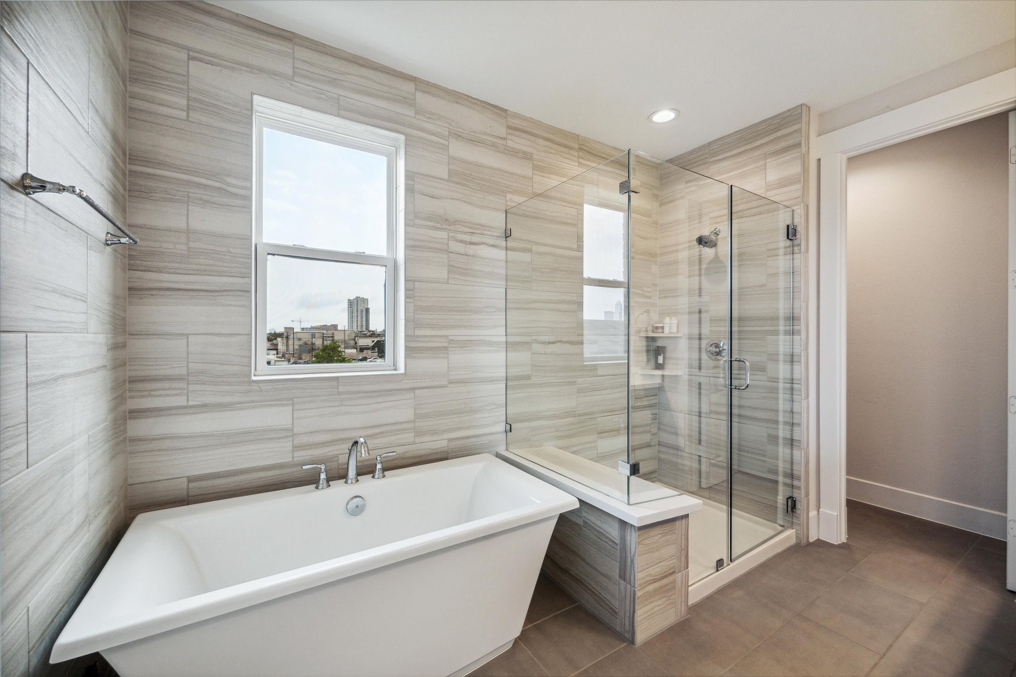 2803 Hicks Street Houston, TX 77007 - Photo 14 of 16 a bathroom with a tub a toilet and a shower