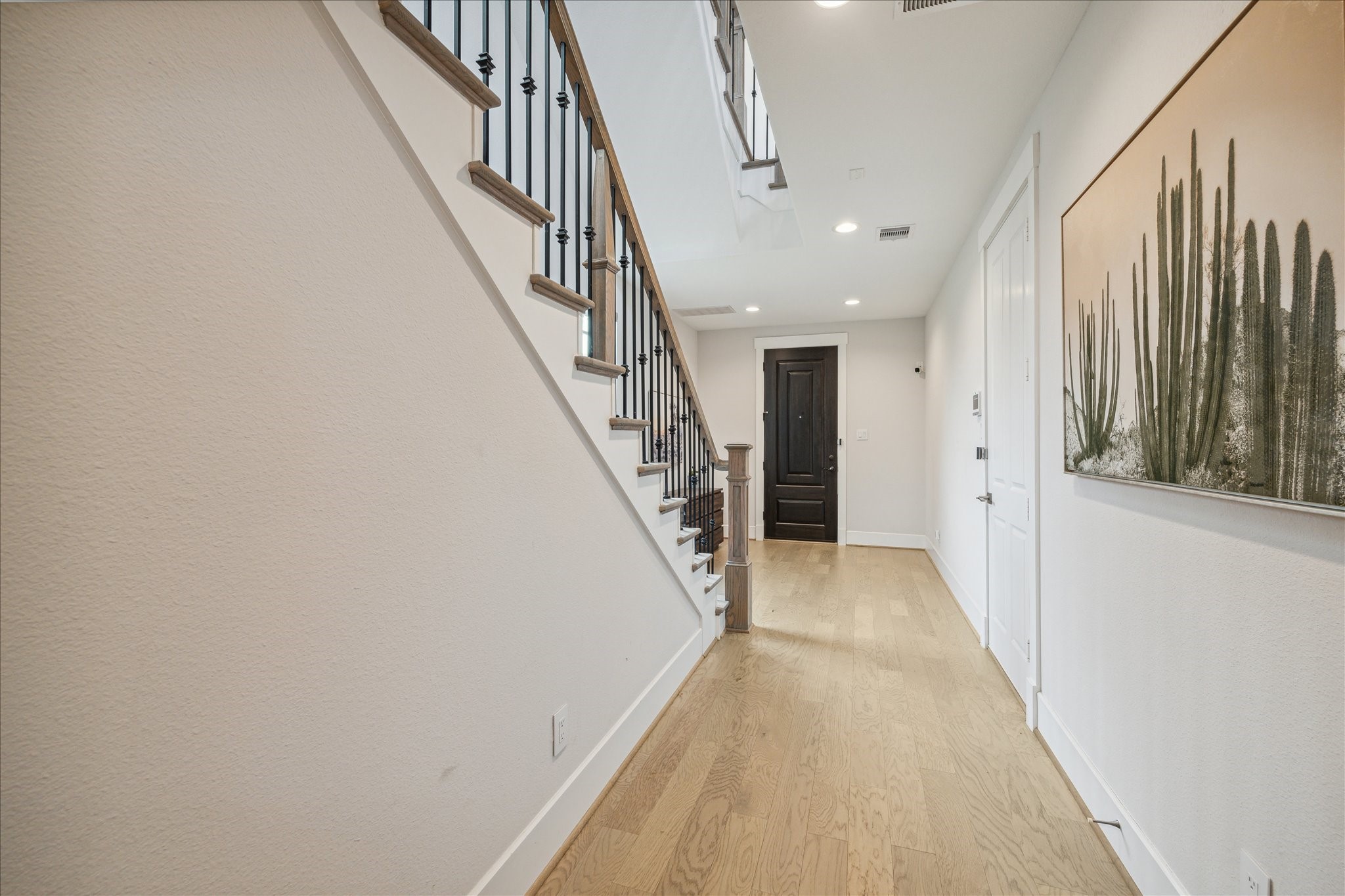 2803 Hicks Street Houston, TX 77007 - Photo 4 of 16 a view of a hallway with wooden floor and entryway