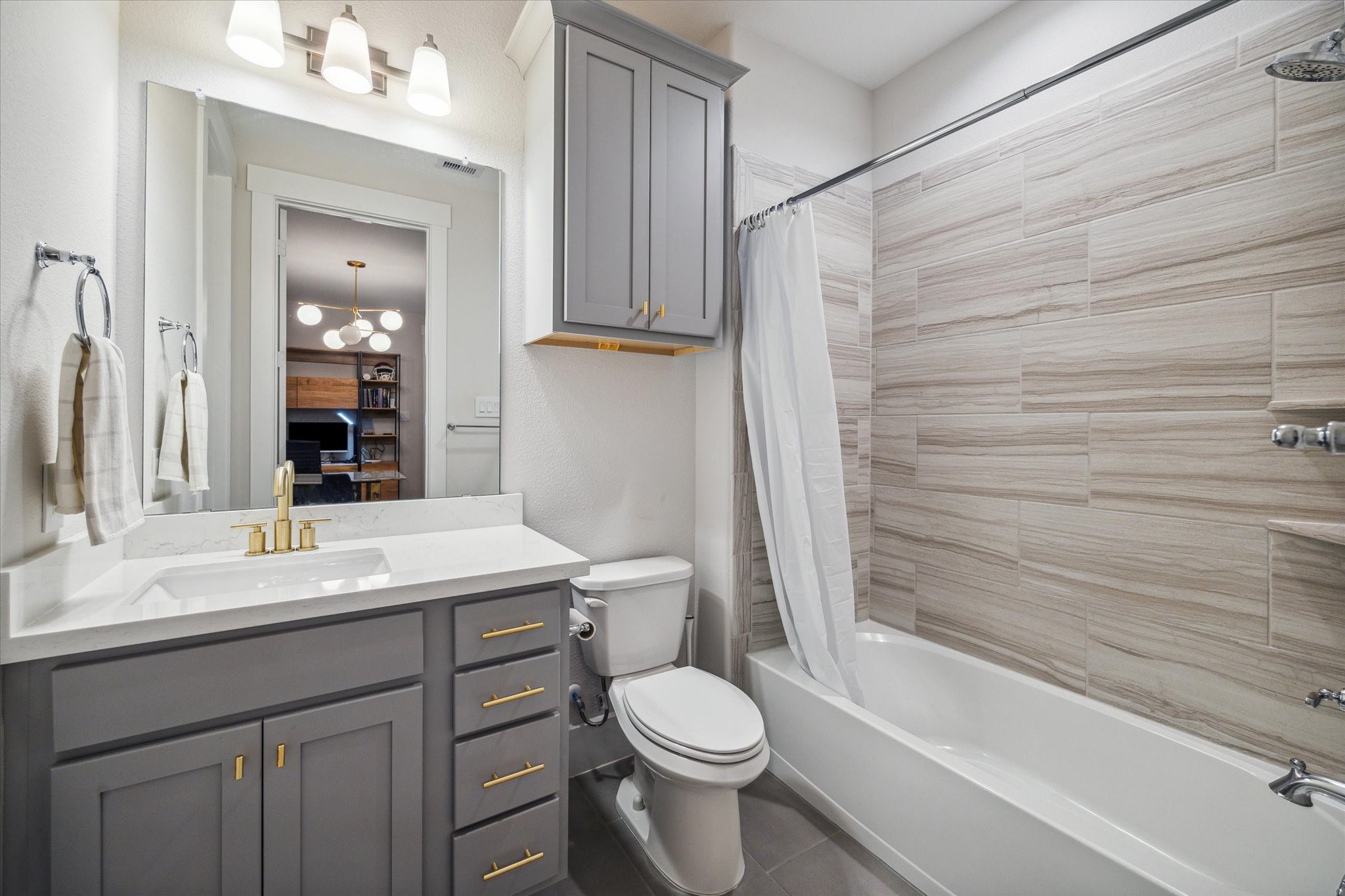 2803 Hicks Street Houston, TX 77007 - Photo 6 of 16 a bathroom with a sink a toilet and shower