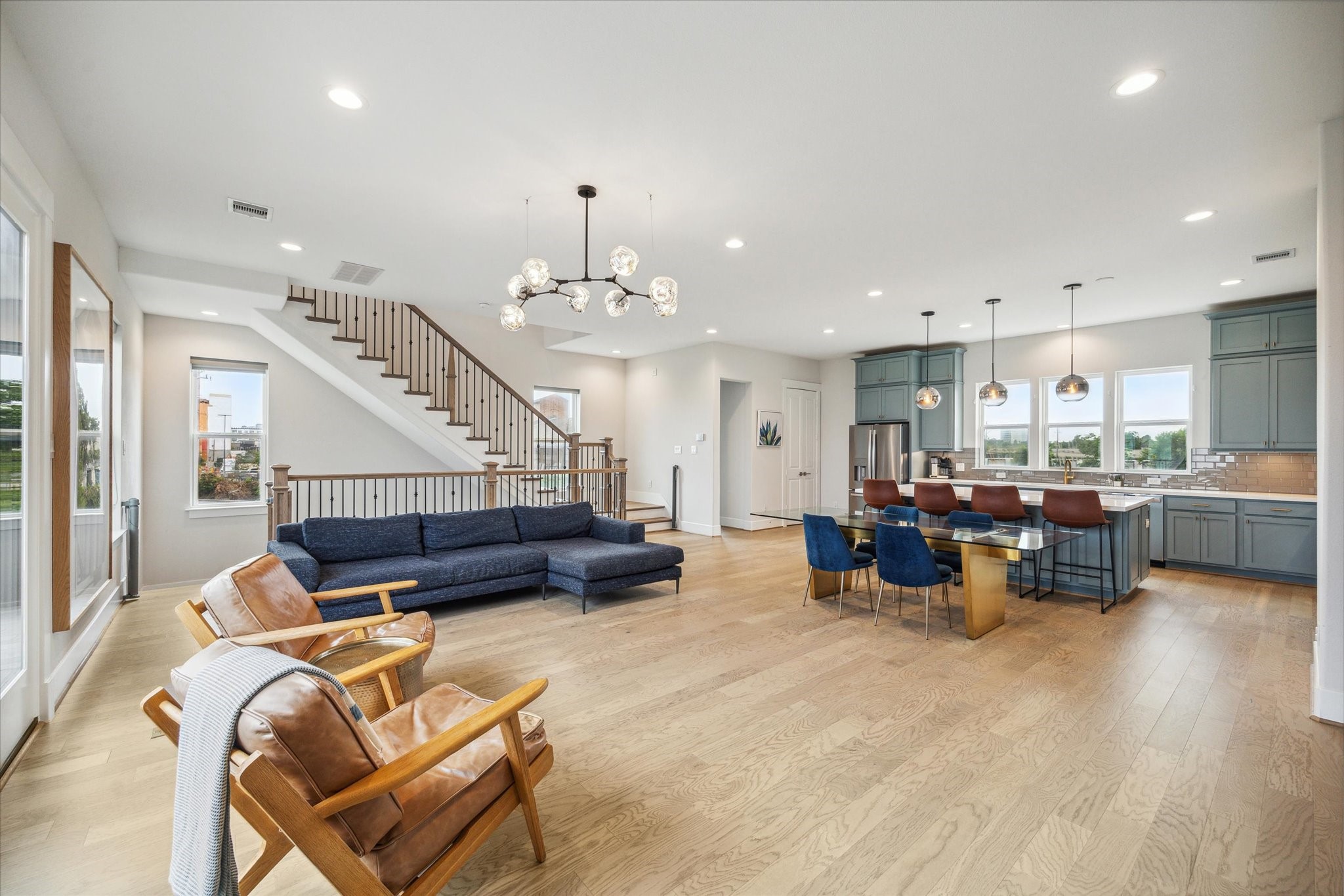 2803 Hicks Street Houston, TX 77007 - Photo 7 of 16 a living room with furniture kitchen view and a chandelier