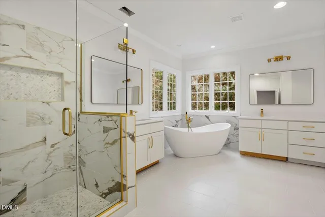 a spacious bathroom with a tub sink shower and mirror