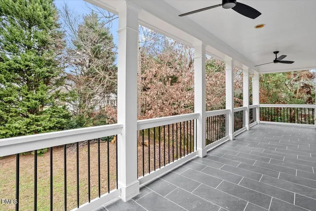 a view of a balcony with wooden floor