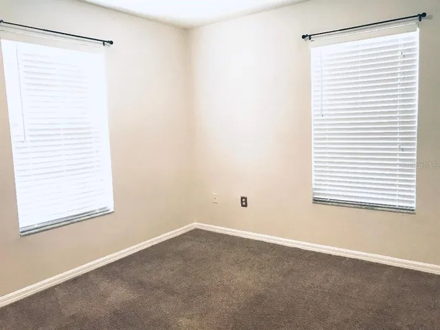 a view of a room that has a window in it