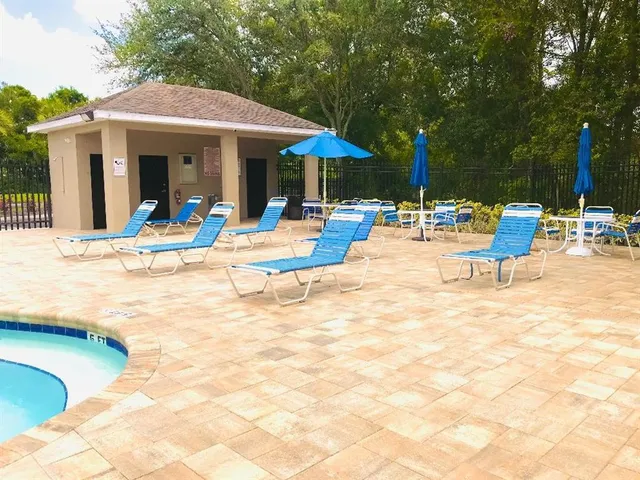 a view of pool with outdoor seating