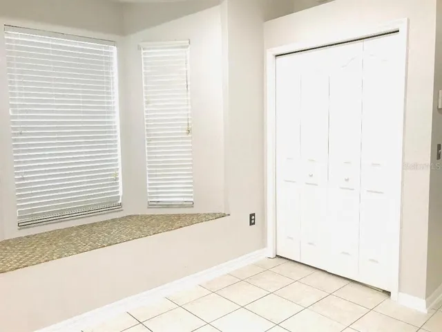 a view of a room that has a window in it