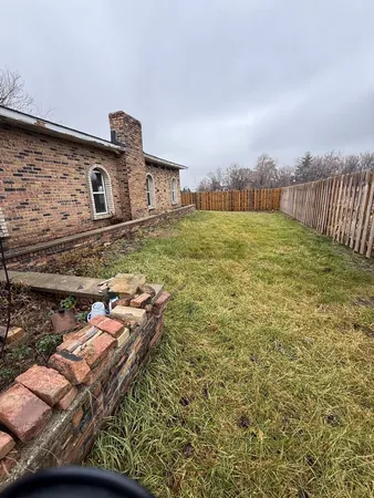 a backyard of a house with lots of green space