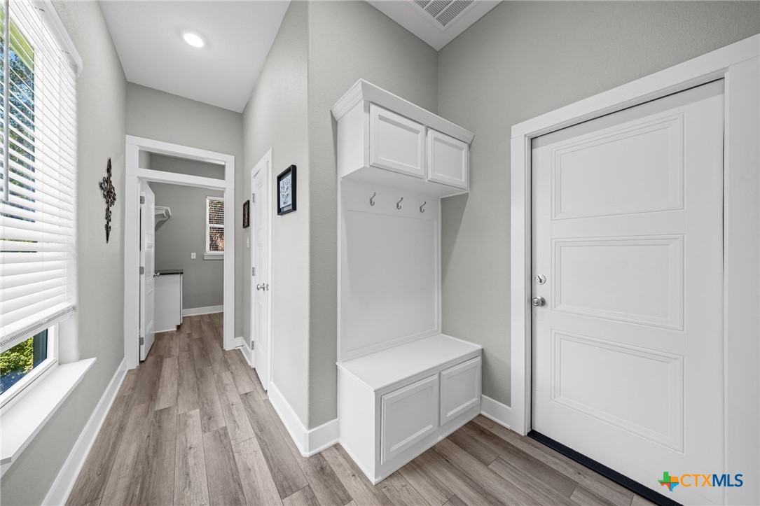 28099 Fm 2670 Killeen, TX 76549 - Photo 6 of 48 a view of a hallway with wooden floor and staircase
