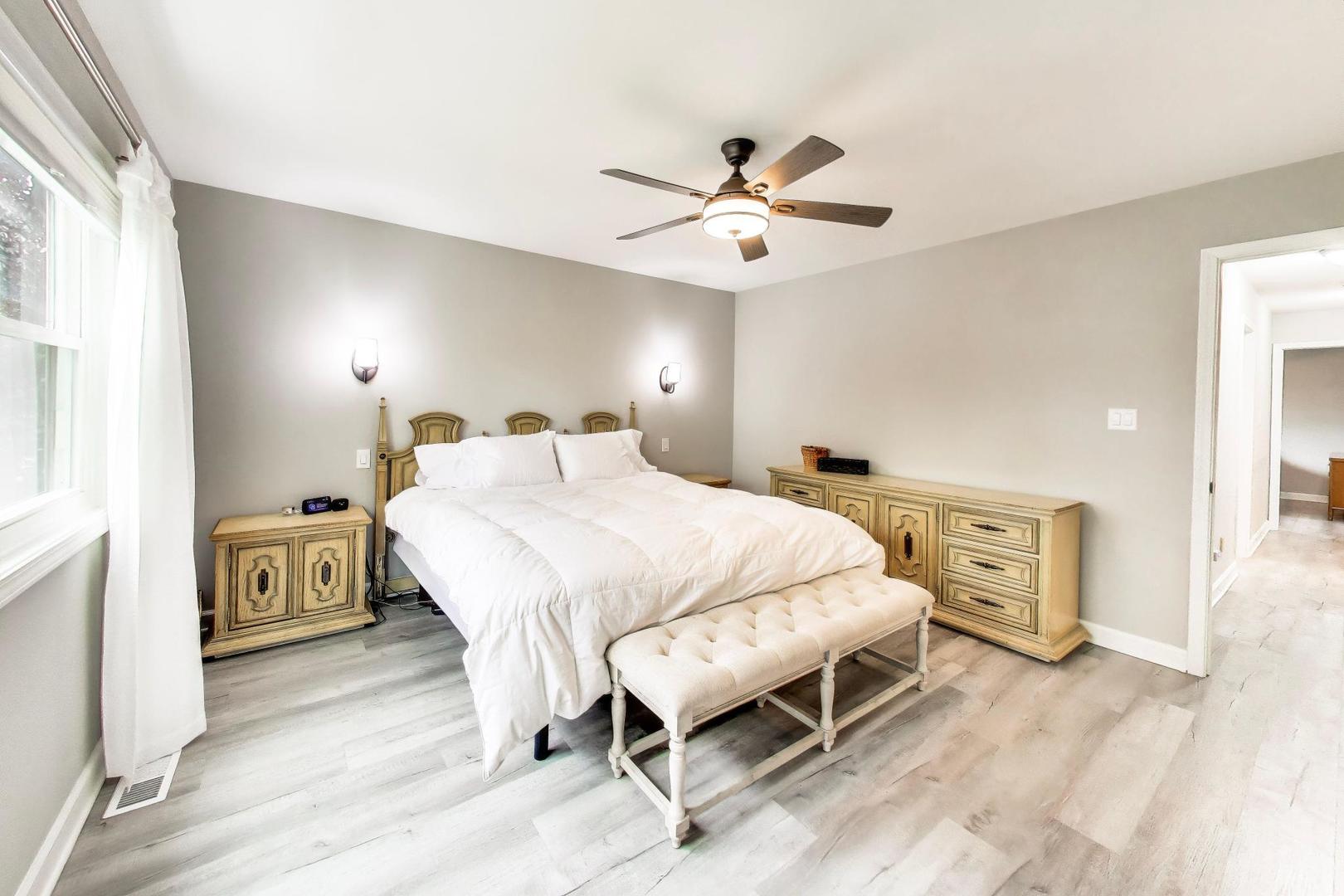 313 South Hi Lusi Avenue Mount Prospect, IL 60056 - Photo 14 of 40 a bedroom with a bed and a chandelier