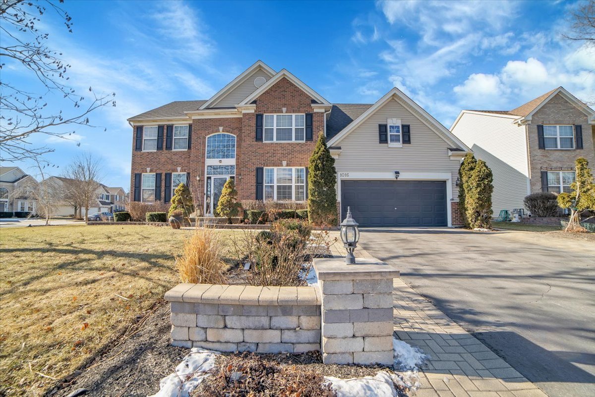 1016 Balmoral Lane Elgin, IL 60120 - Photo 1 of 44 a front view of a house with a yard
