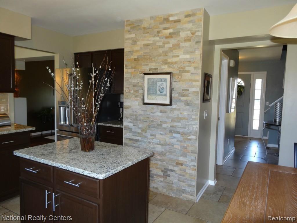 4335 North Ridge Drive Pinckney, MI 48169 - Photo 15 of 42 Gorgeous Natural Stone Accent Wall!