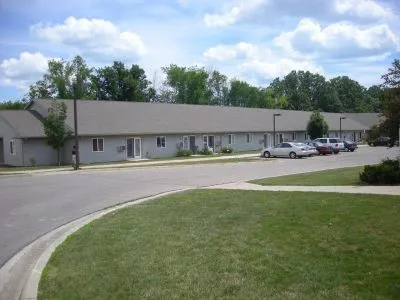 a view of swimming pool and trees in the background