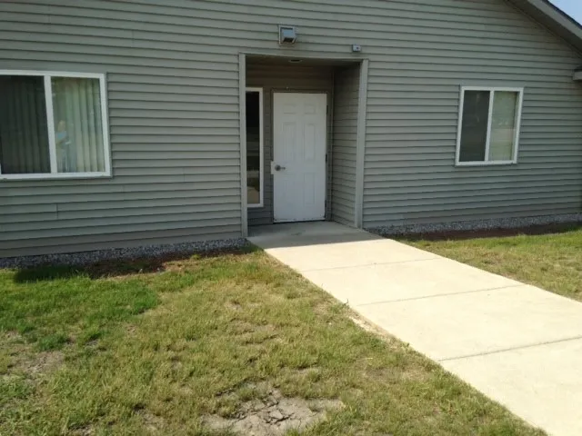 a view of backyard of a house