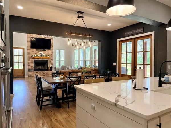 a living room with fireplace furniture and a flat screen tv