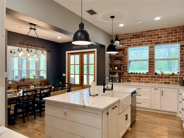 a kitchen with a stove a sink and a refrigerator