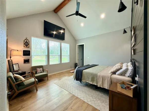 a bedroom with bed room and window