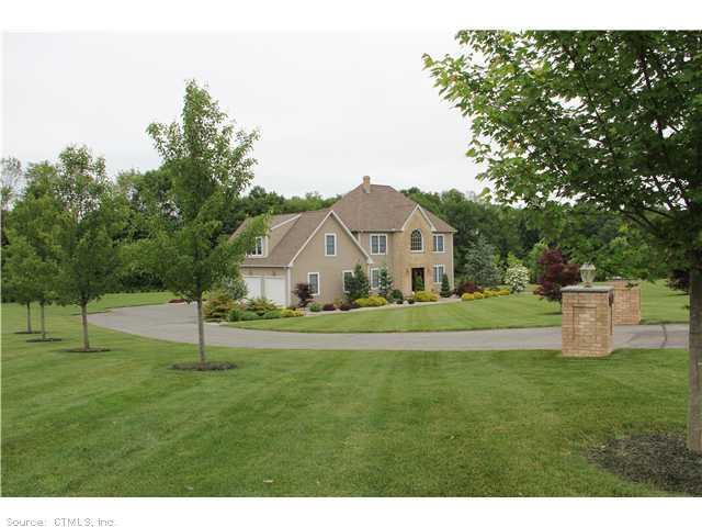 26 Berten Ridge Road Durham, CT 06422 - Photo 1 of 1 a view of a house with a big yard and large trees