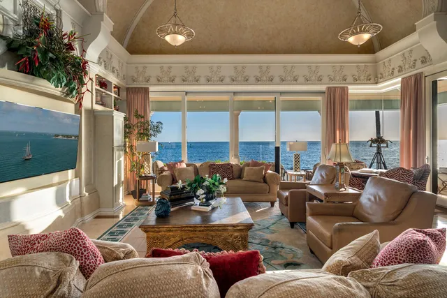 a view of a house with backyard porch and sitting area