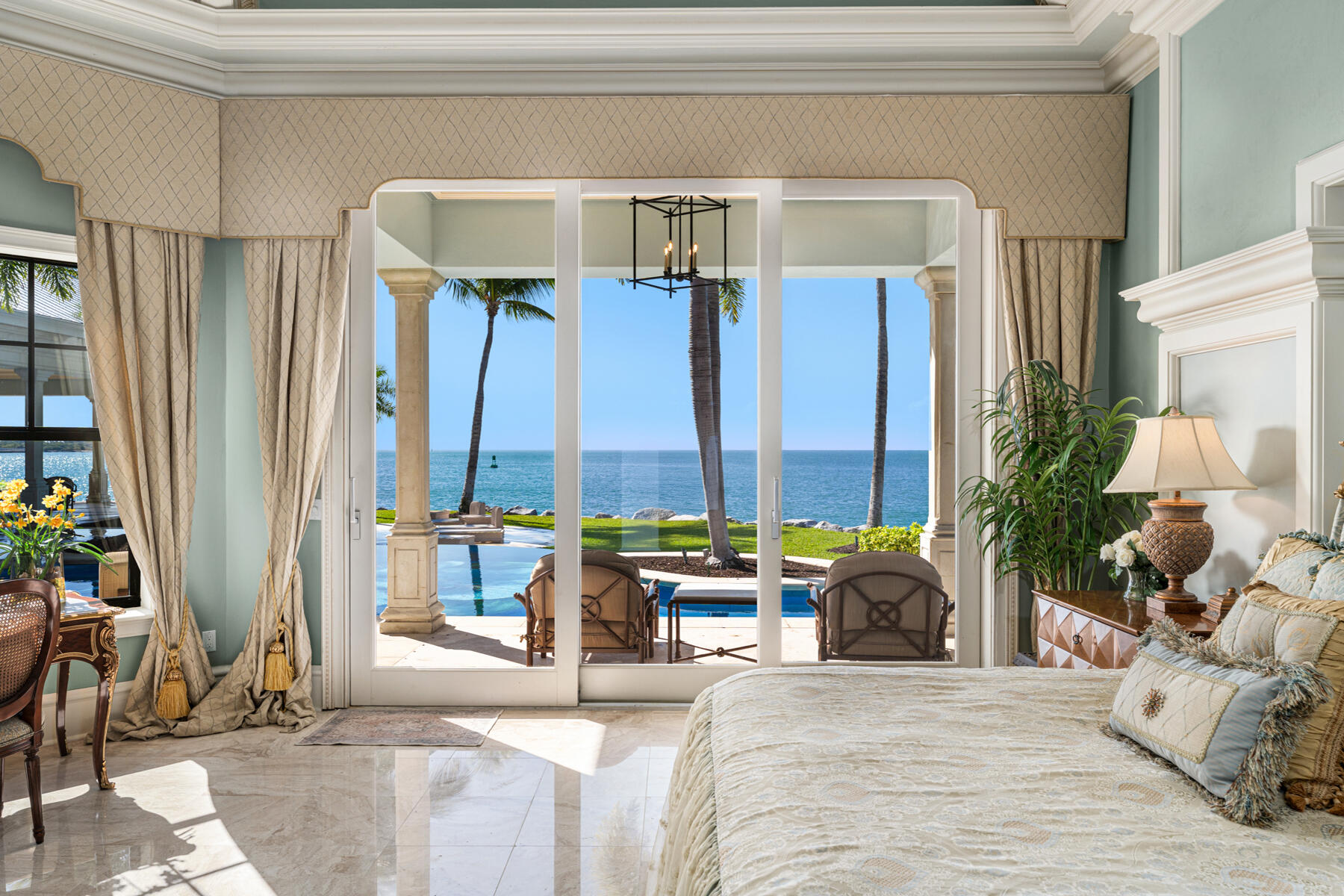 19 Sunset Key Drive Key West, FL 33040 - Photo 35 of 98 a bedroom with furniture and large windows