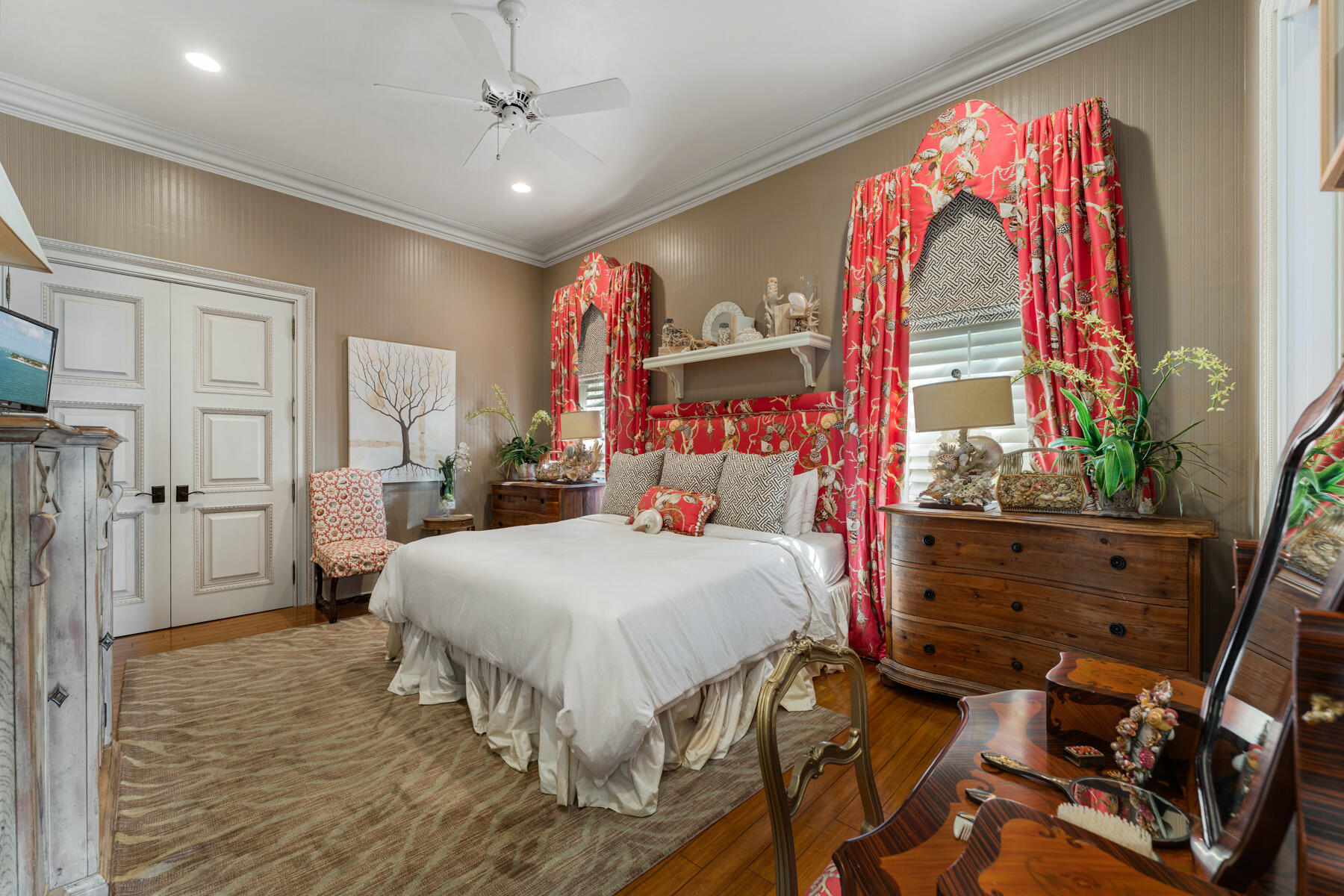 19 Sunset Key Drive Key West, FL 33040 - Photo 47 of 98 a bed room with a bed and a chandelier