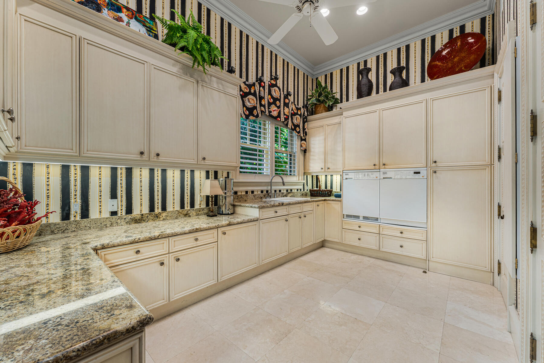 19 Sunset Key Drive Key West, FL 33040 - Photo 50 of 98 a kitchen with granite countertop white cabinets and white appliances