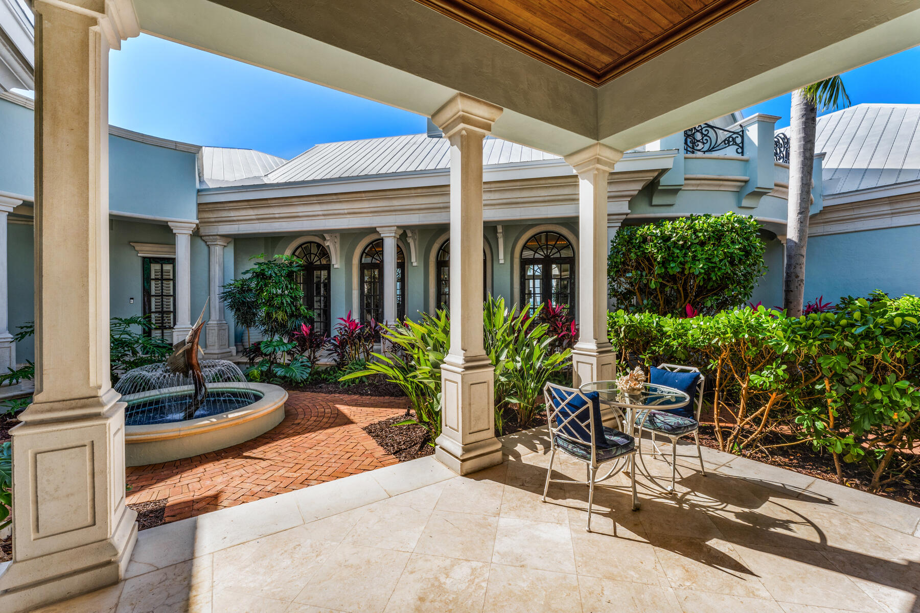19 Sunset Key Drive Key West, FL 33040 - Photo 58 of 98 a view of a patio with table and chairs potted plants