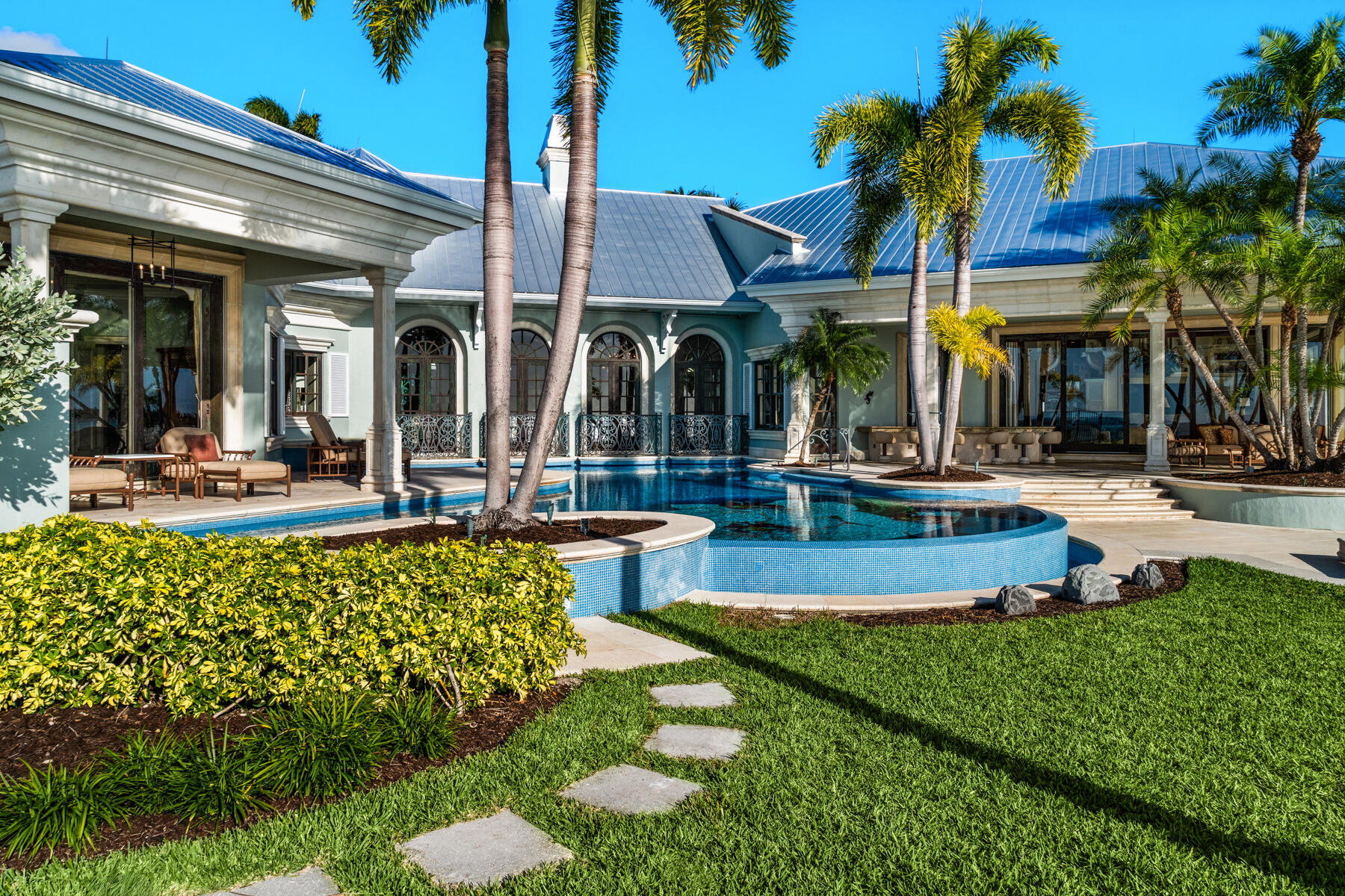 19 Sunset Key Drive Key West, FL 33040 - Photo 66 of 98 a view of a swimming pool with an outdoor seating