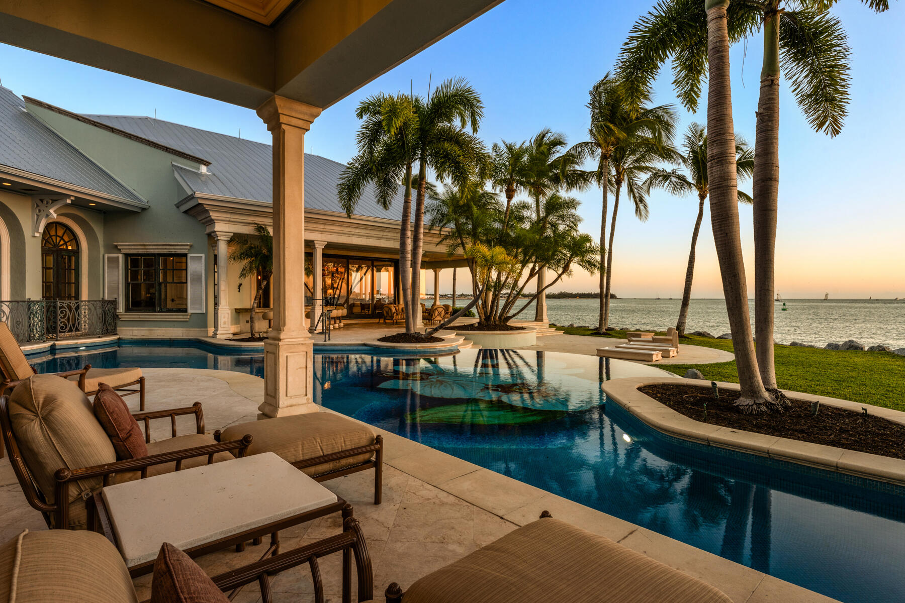 19 Sunset Key Drive Key West, FL 33040 - Photo 69 of 98 a view of a swimming pool with a table and chairs