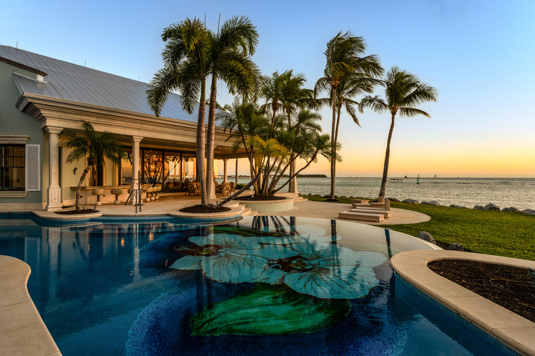 19 Sunset Key Drive Key West, FL 33040 - Photo 70 of 98 a view of a swimming pool with a table and chairs