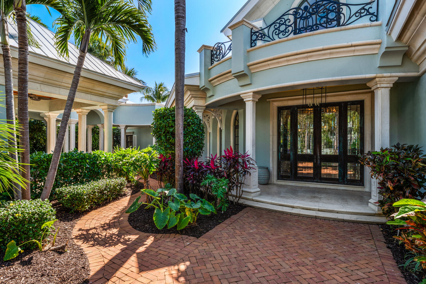 19 Sunset Key Drive Key West, FL 33040 - Photo 9 of 98 a view of a house with potted plants and a flower garden