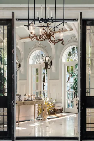 a living room with furniture a ceiling fan and a window