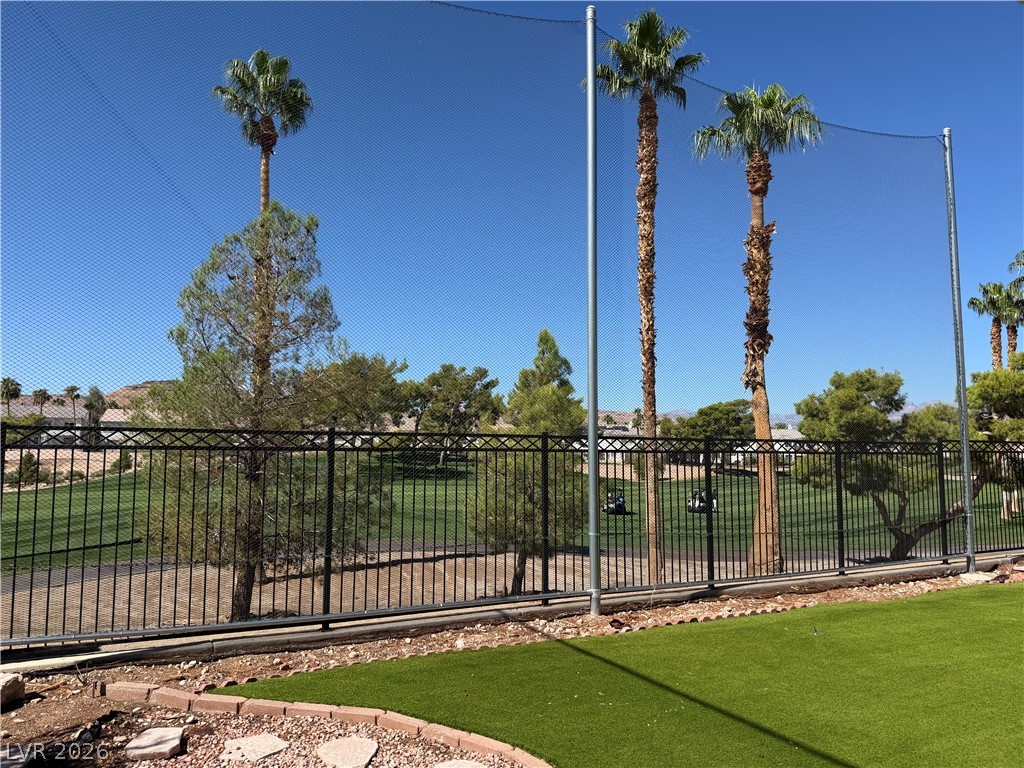 141 Rancho Maria Street Las Vegas, NV 89148 - Photo 29 of 30 Lush fairways stretch beyond the secure perimeter fence of this properties backyard.