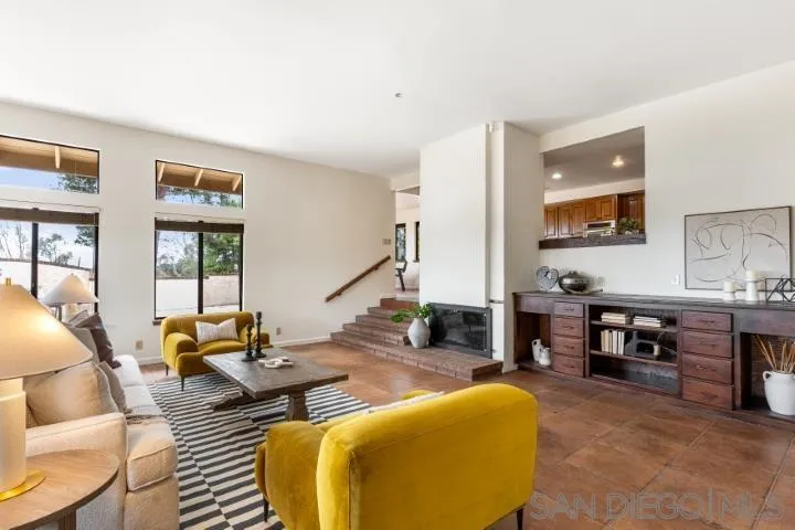 3253 Yucca Terrace Fallbrook, CA 92028 - Photo 14 of 62 a living room with furniture stove and a large window