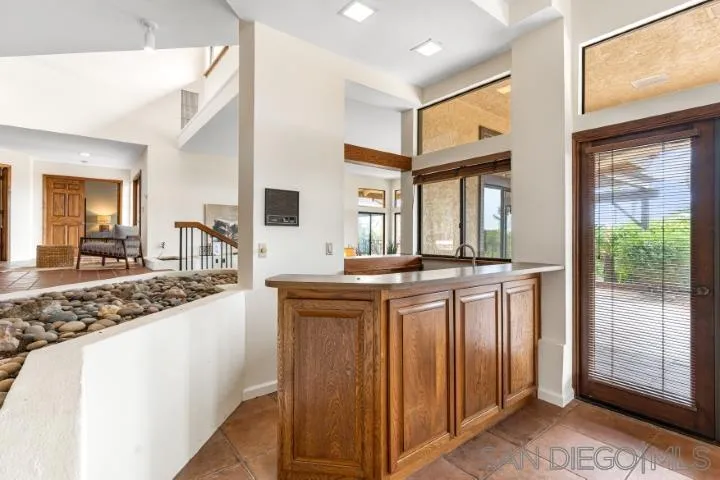 3253 Yucca Terrace Fallbrook, CA 92028 - Photo 15 of 62 a kitchen with stainless steel appliances granite countertop a refrigerator and a sink
