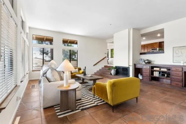 a kitchen that has a sink and a stove in it