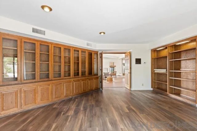 a living room with furniture large window and a table