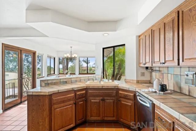 a kitchen with a table and chairs