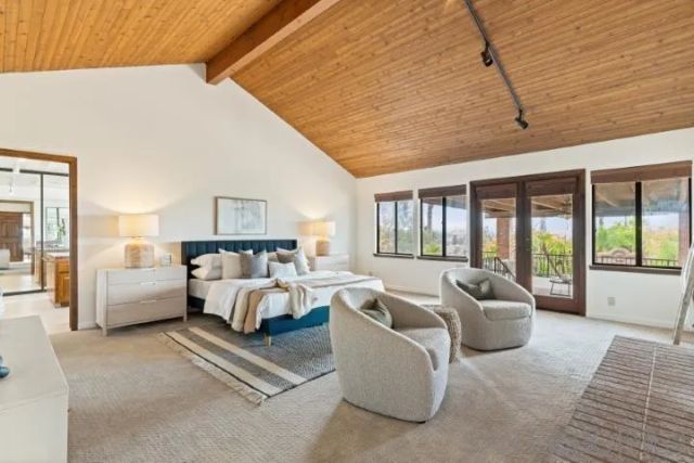 a dining hall with stainless steel appliances granite countertop a stove and a large window