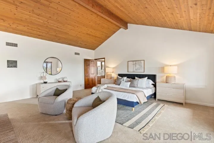 3253 Yucca Terrace Fallbrook, CA 92028 - Photo 30 of 62 a bed room with furniture and a chandelier