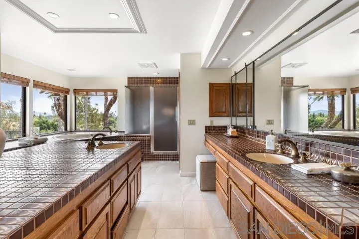 3253 Yucca Terrace Fallbrook, CA 92028 - Photo 32 of 62 a kitchen with counter top space a sink and refrigerator