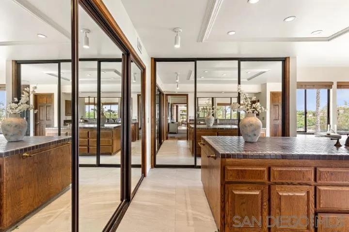 3253 Yucca Terrace Fallbrook, CA 92028 - Photo 35 of 62 a dining hall with stainless steel appliances granite countertop a stove and a large window