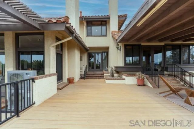 front view of a house with a tree