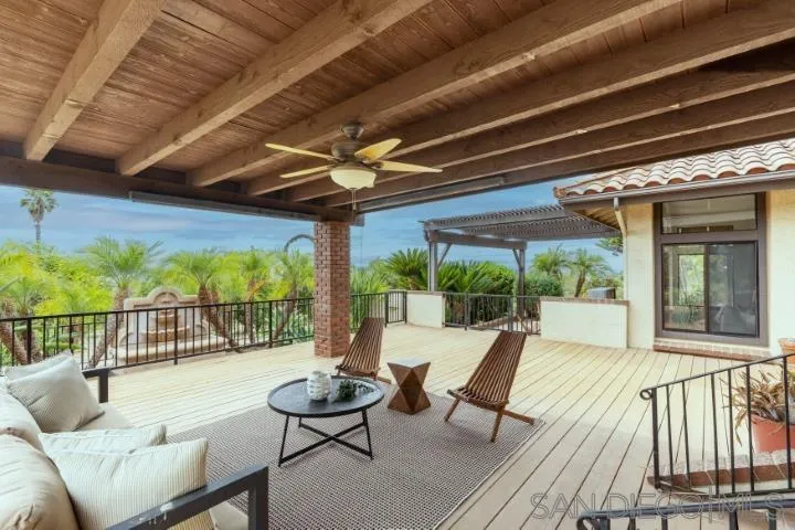 3253 Yucca Terrace Fallbrook, CA 92028 - Photo 45 of 62 a view of a patio with a dining table and chairs