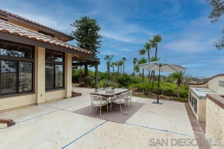 3253 Yucca Terrace Fallbrook, CA 92028 - Photo 46 of 62 a view of a patio with couches table and chairs and potted plants