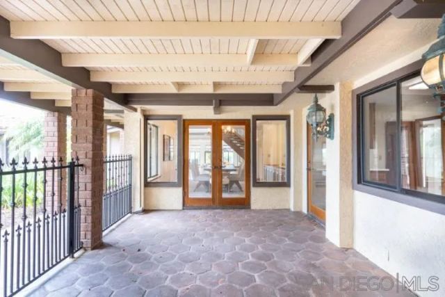 an aerial view of a house with garden space and street view