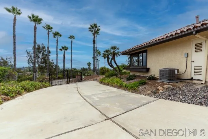 3253 Yucca Terrace Fallbrook, CA 92028 - Photo 51 of 62 a house with a yard and potted plants