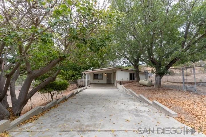 3253 Yucca Terrace Fallbrook, CA 92028 - Photo 54 of 62 front view of a house with a tree