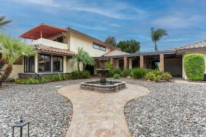 3253 Yucca Terrace Fallbrook, CA 92028 - Photo 59 of 62 a front view of a house with garden