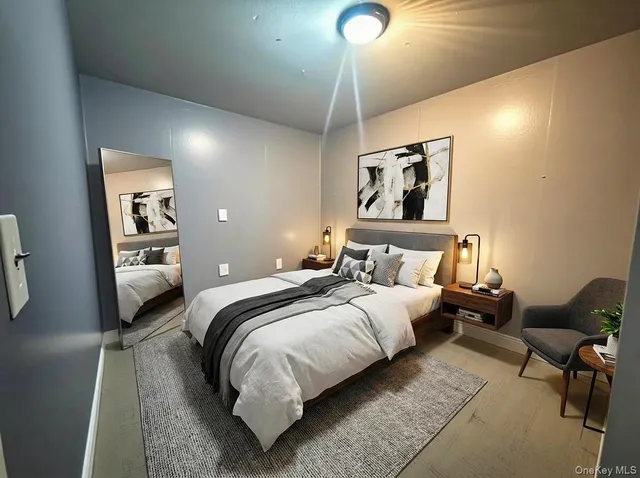 a bedroom with a bed and lamp